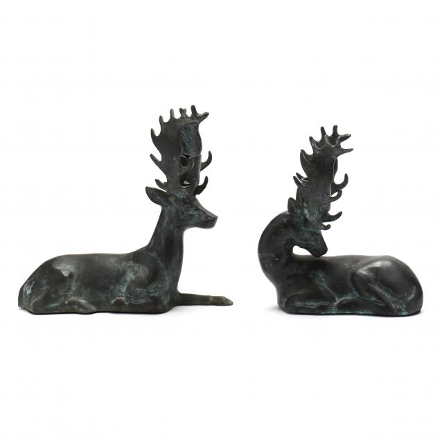 pair-of-cast-metal-recumbent-stag-candle-holders