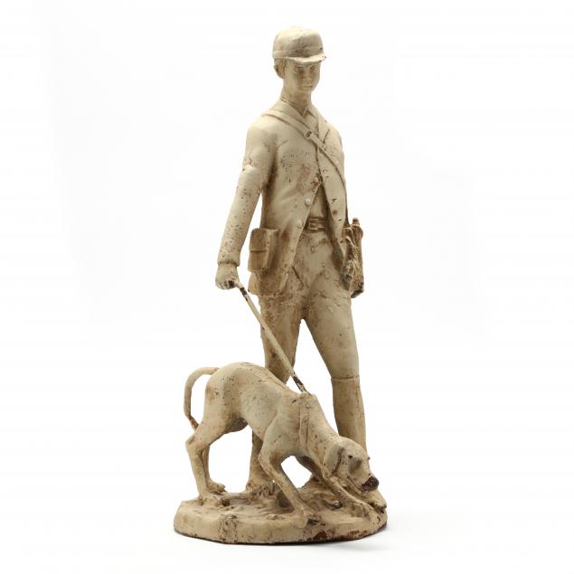 a-vintage-cast-iron-sculpture-of-footsman-and-foxhound