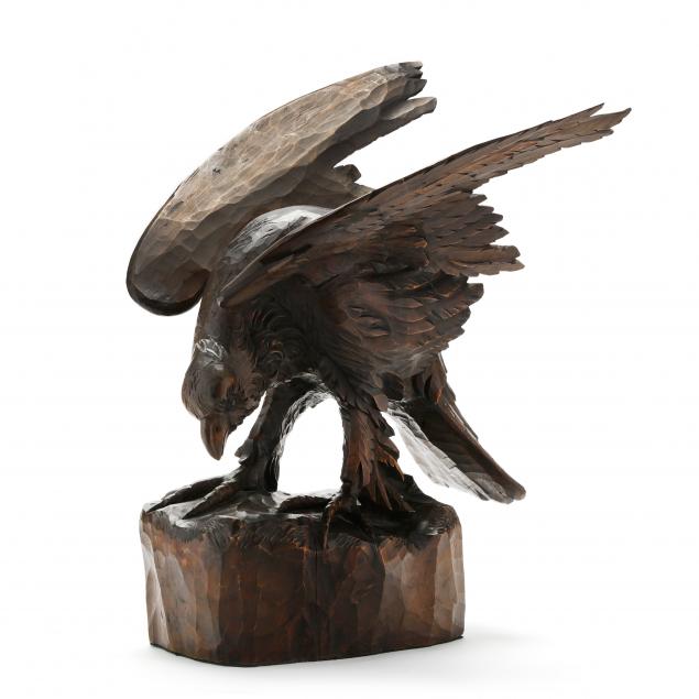 a-near-life-size-carved-wood-figure-of-an-eagle