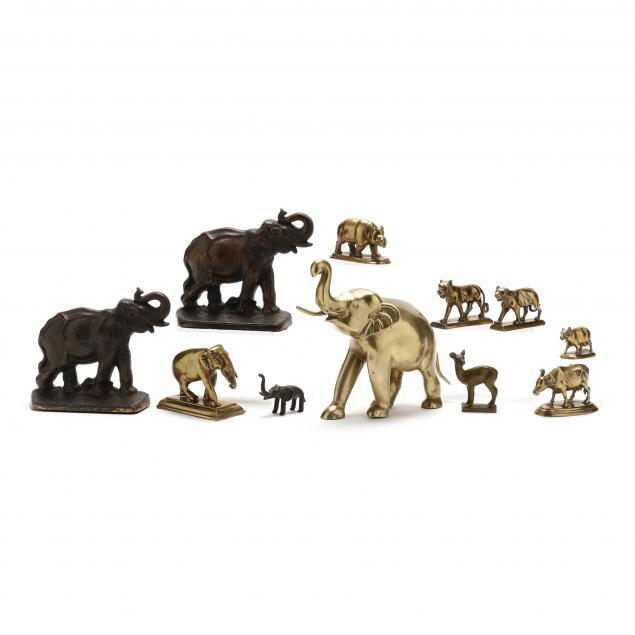 a-grouping-of-eleven-cast-metal-objects-of-mammals