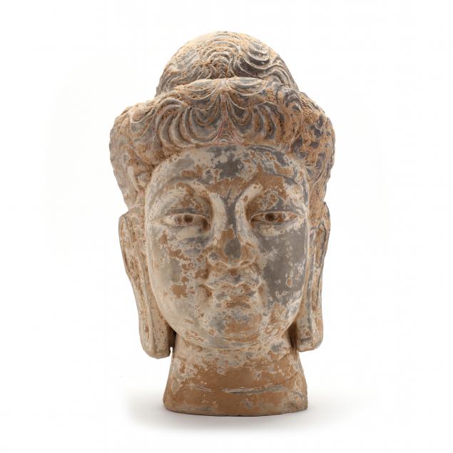 a-large-pottery-buddha-head