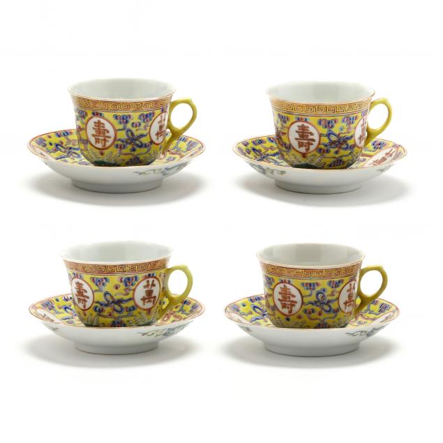 a-set-of-four-chinese-porcelain-famille-jaune-birthday-cups-and-saucers