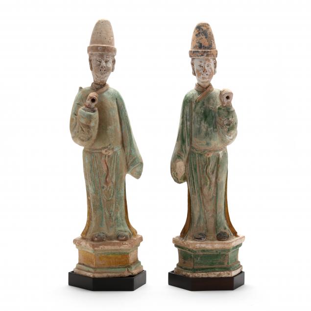 a-pair-of-chinese-green-and-amber-glazed-tomb-attendant-figures