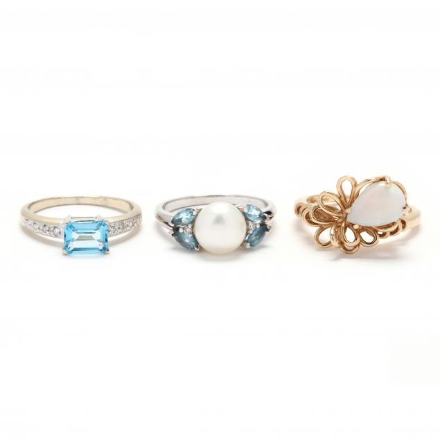 three-gold-and-gem-set-rings