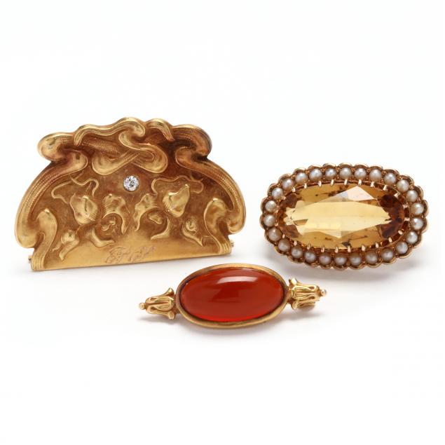 three-antique-gold-and-gem-set-brooches
