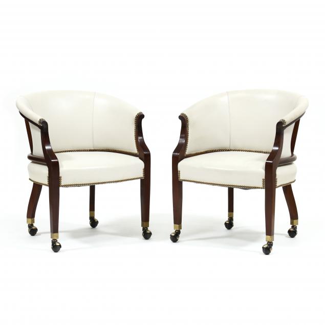 pair-of-leather-upholstered-barrel-back-armchairs