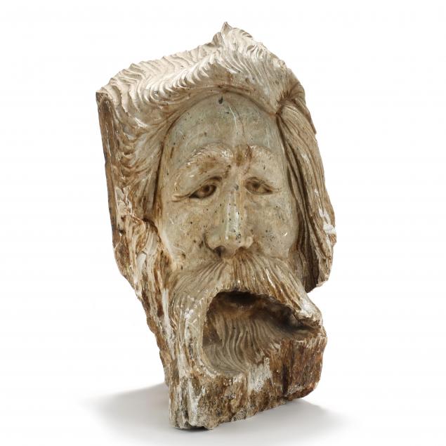 a-lifesize-carved-stone-head-of-a-bearded-man