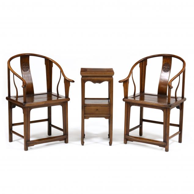 a-pair-of-chinese-horseshoe-chairs-and-side-table