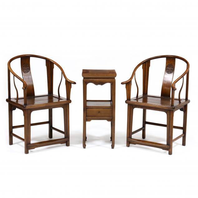 a-pair-of-chinese-horseshoe-chairs-and-side-table