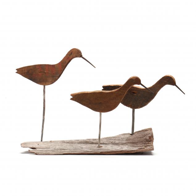 trio-of-yellowlegs-silhouette-decoys-on-driftwood