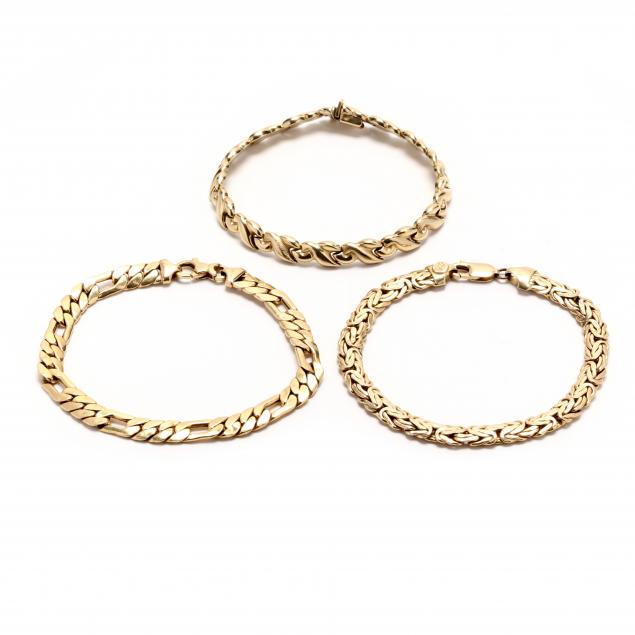 three-gold-bracelets
