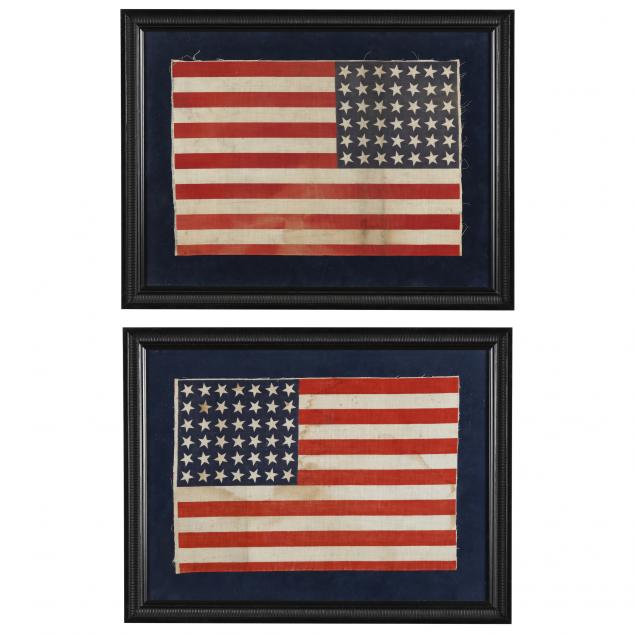 opposing-42-star-united-states-flags-in-two-painted-wooden-frames