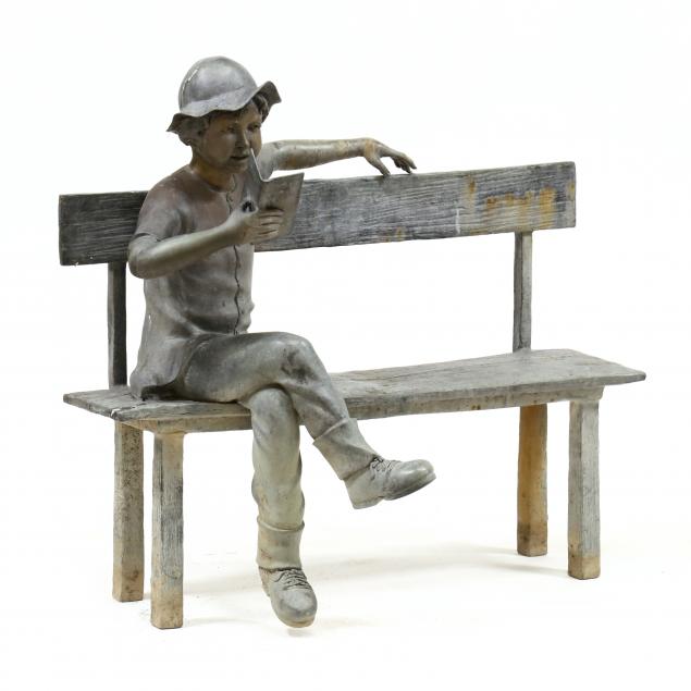 a-large-bronze-garden-statue-of-child-reading