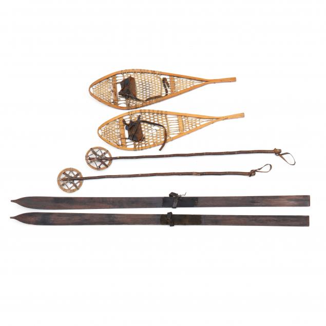 pair-of-vintage-wooden-skis-poles-and-snow-shoes