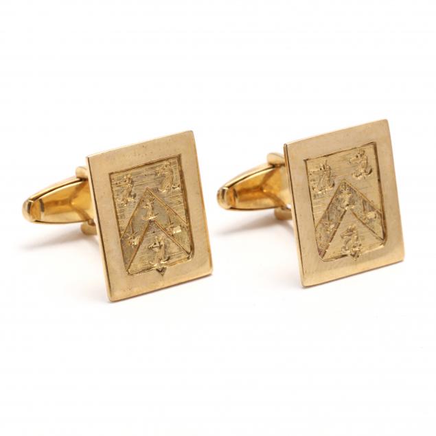 pair-of-gold-cufflinks