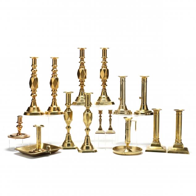 a-collection-of-15-antique-continental-brass-candlesticks