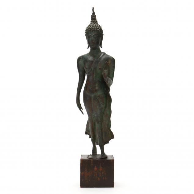 a-thai-bronze-walking-buddha-sculpture