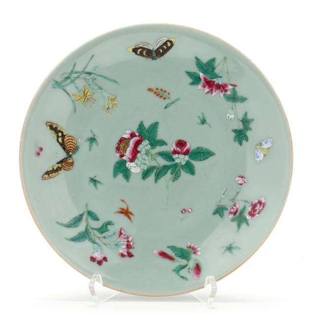 a-chinese-celadon-ground-plate-with-flora-and-butterflies