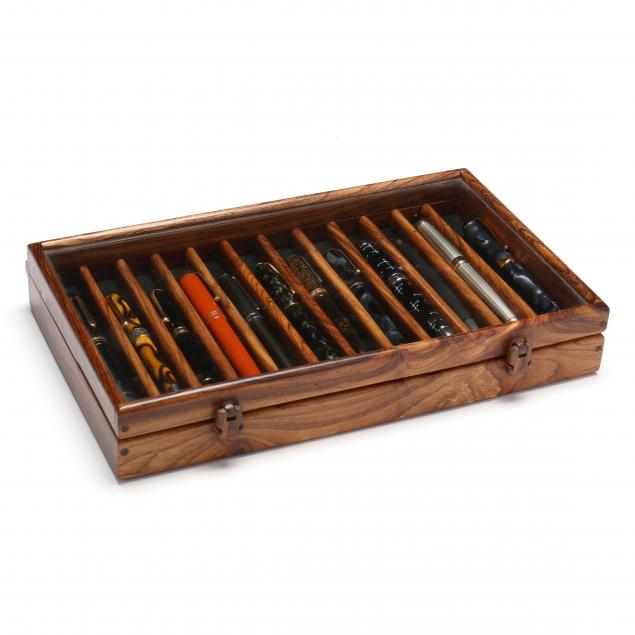 a-cased-set-of-13-writing-instruments