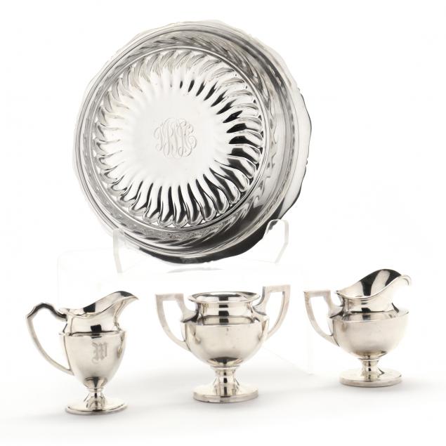 a-grouping-of-four-sterling-silver-tableware-items