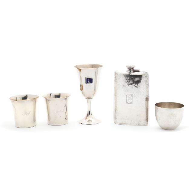 four-sterling-silver-drinking-vessels-and-a-flask