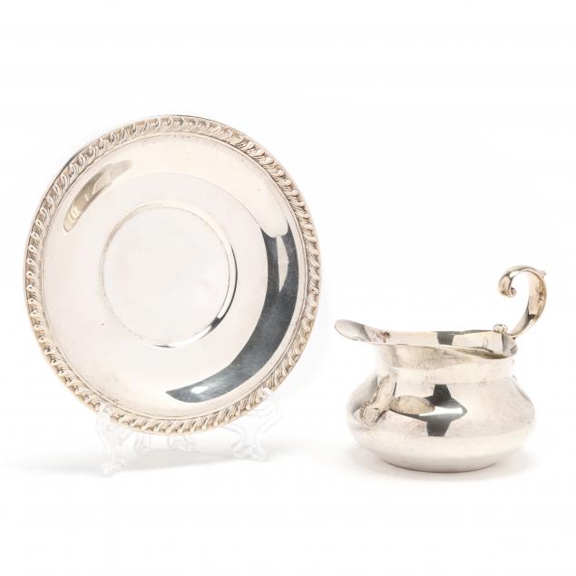 a-sterling-silver-creamer-and-underplate-by-poole