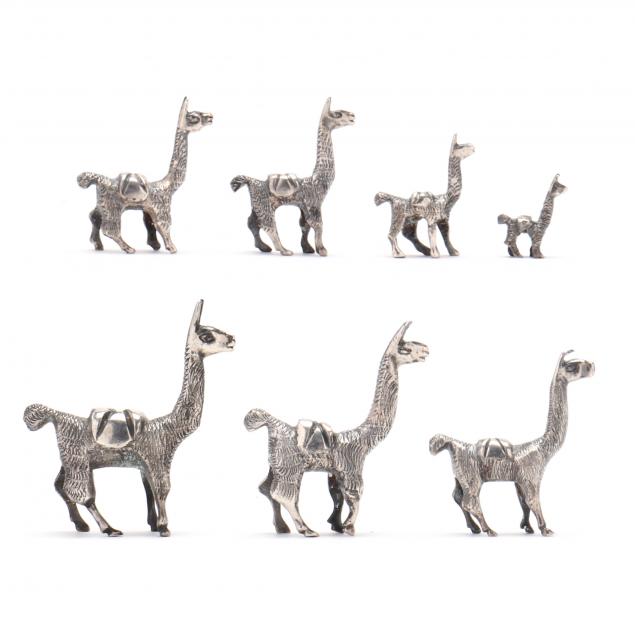 cased-collection-of-seven-peruvian-silver-miniature-llamas