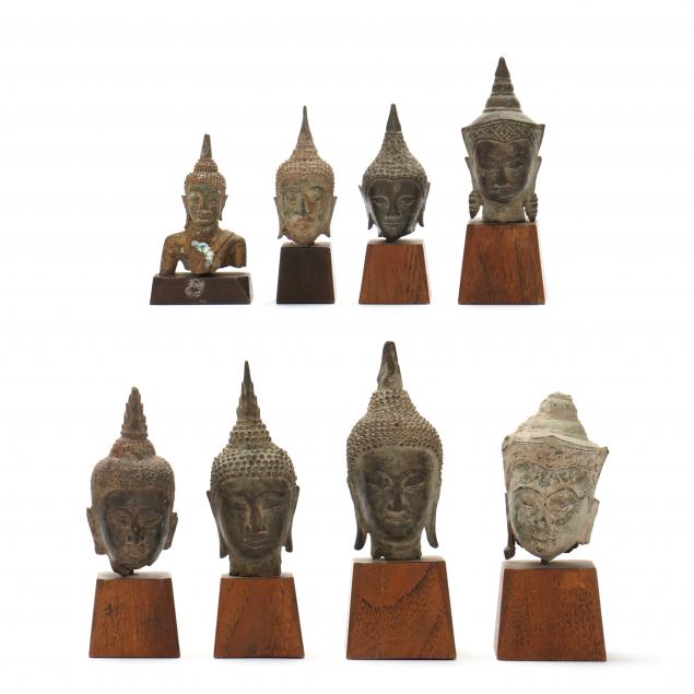 a-group-of-bronze-buddha-heads-from-thailand-and-cambodia