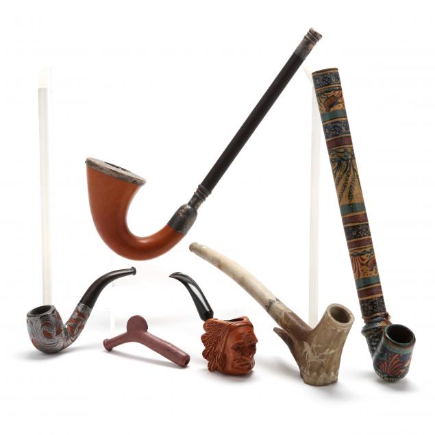 a-six-piece-grouping-of-antique-and-vintage-pipes