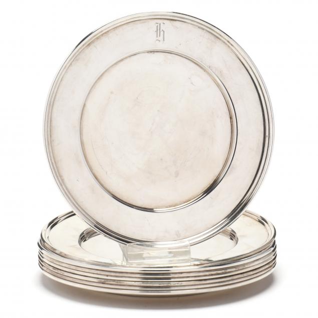 a-set-of-eight-sterling-silver-bread-plates-by-cartier