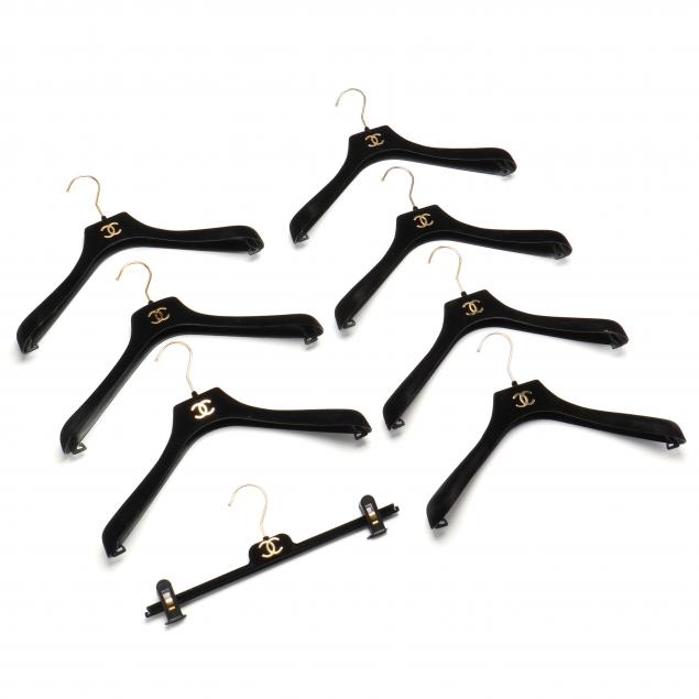 a-group-of-eight-chanel-clothing-hangers