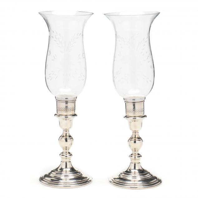 pair-of-sterling-silver-candlesticks-retailed-by-cartier-fitted-as-hurricane-lamps