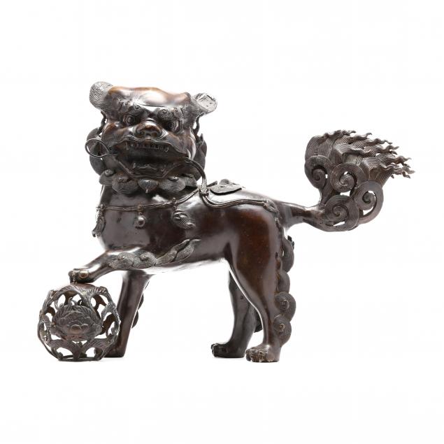 a-chinese-bronze-foo-lion-standing-on-a-ball