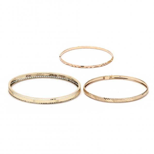 three-gold-bangle-bracelets