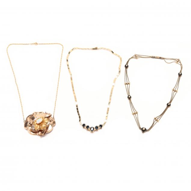 three-gold-and-gem-set-necklaces