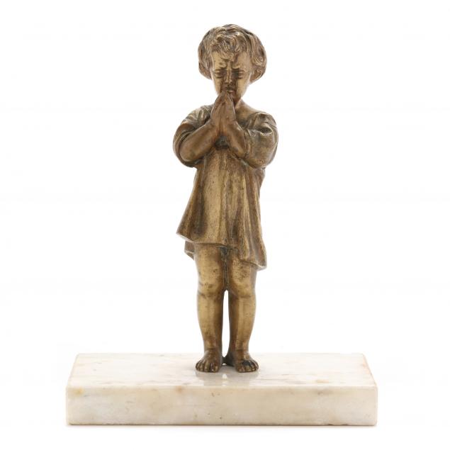 an-antique-bronze-sculpture-of-a-praying-child