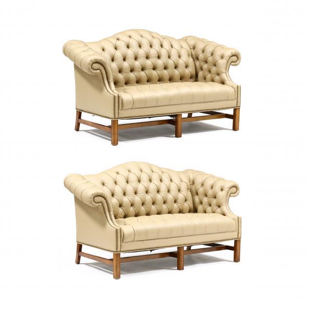 pair-of-chippendale-style-tufted-leather-settees