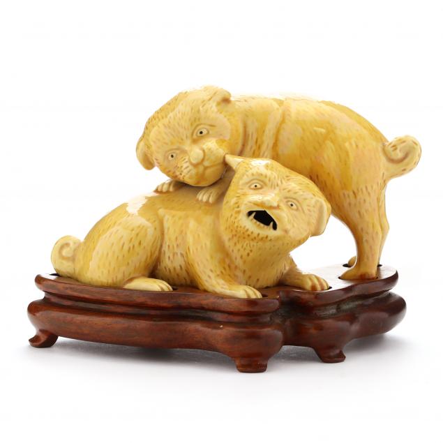 a-japanese-yellow-glazed-porcelain-group-of-puppies