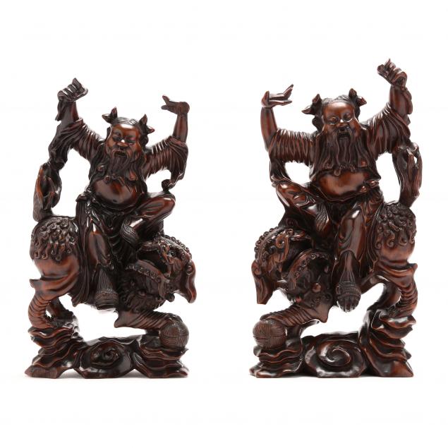 pair-of-chinese-carved-wood-figurals-of-laughing-buddha-riding-foo-lions
