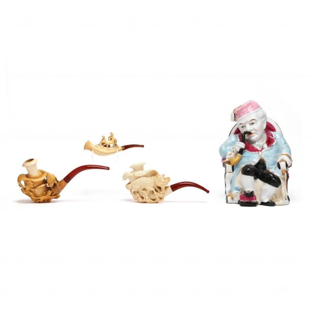 a-german-porcelain-figural-bank-and-three-meerschaum-pipes
