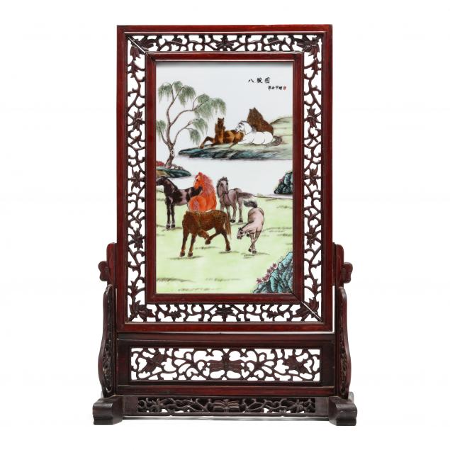a-chinese-porcelain-plaque-with-horses-and-a-wooden-carved-table-screen