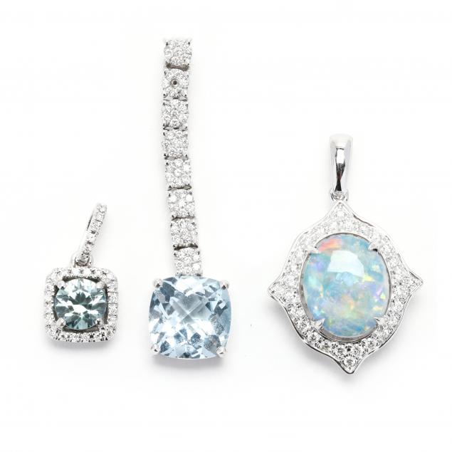 three-white-gold-and-gem-set-pendants