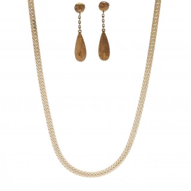 a-gold-herringbone-necklace-and-a-pair-of-gold-dangle-earrings