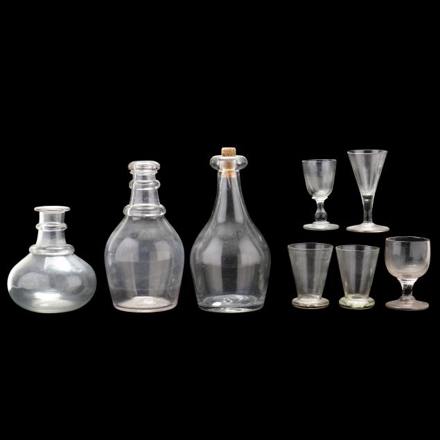 three-antique-glass-decanters-and-five-wine-glasses