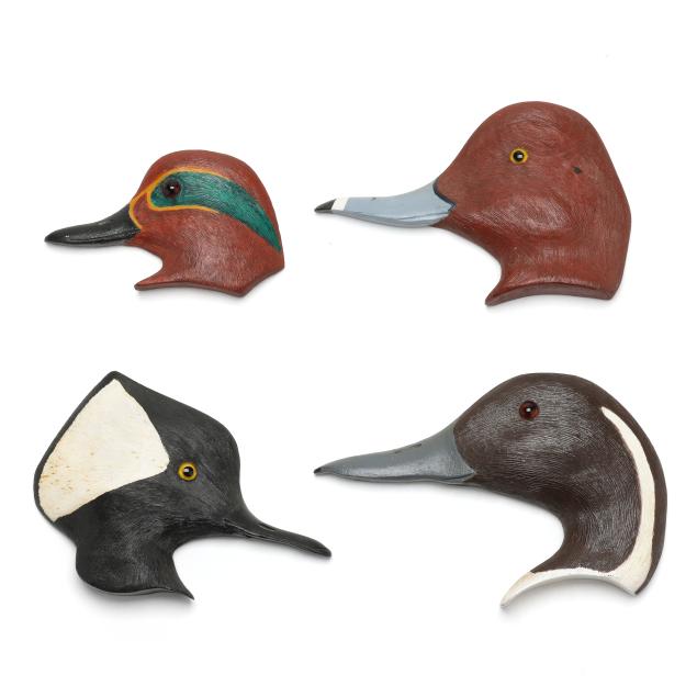 merritt-pennock-md-four-carved-profile-heads