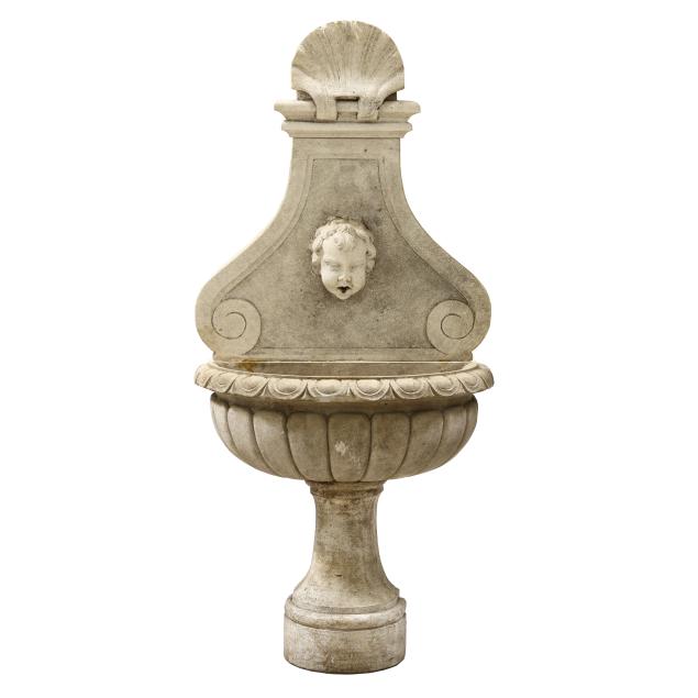 baroque-style-stone-wall-fountain-with-putto-spout
