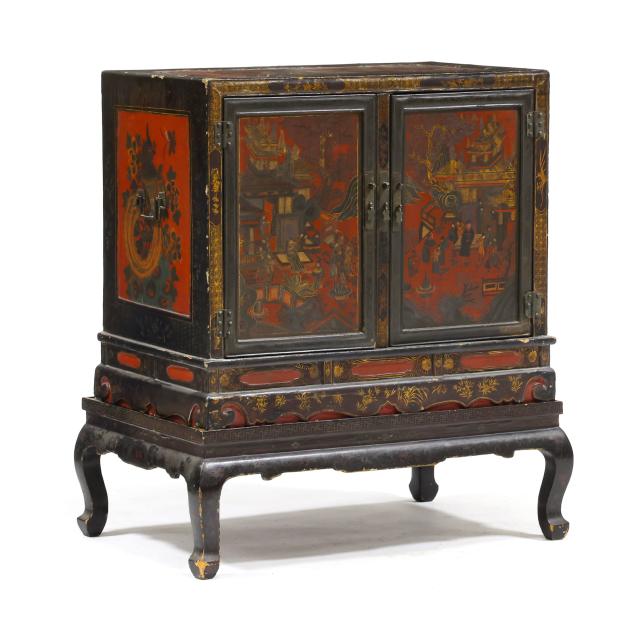a-chinese-lacquered-and-gilt-cabinet-on-stand