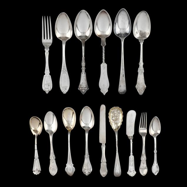selection-of-coin-silver-flatware-with-ornate-handles