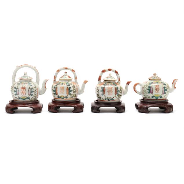 four-chinese-porcelain-famille-rose-teapots-on-stands
