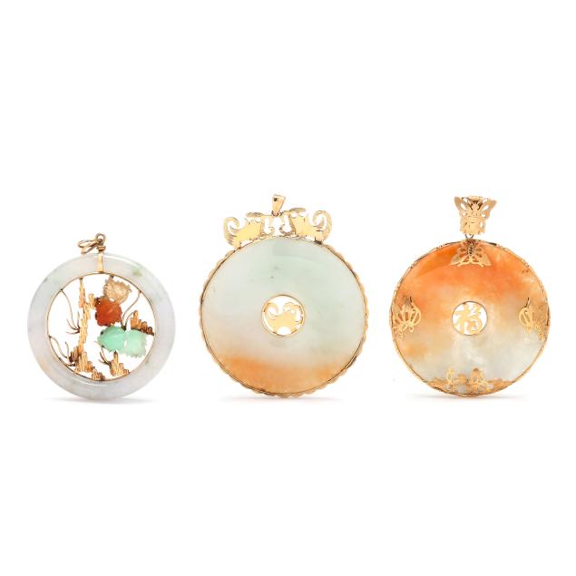 three-gold-and-carved-jadeite-jade-pendants
